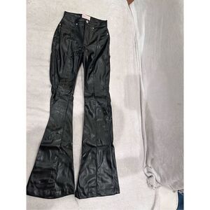 REVICE size 24 black leather pants women’s with huge star on the back